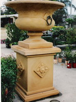 Semi classic urn and pedestal with bronzed rings, aged terracotta semi formal finish