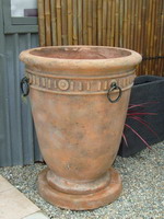 large tuscan planter pot with bronzed rings, aged terracotta semi formal finish on drip tray  plinth